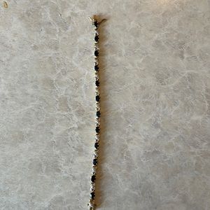 Gold braces with sapphires and small diamonds